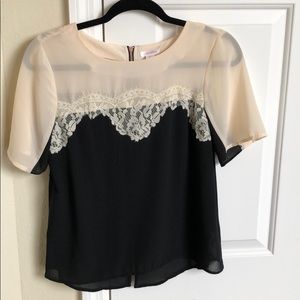 Black and cream top with lace accents